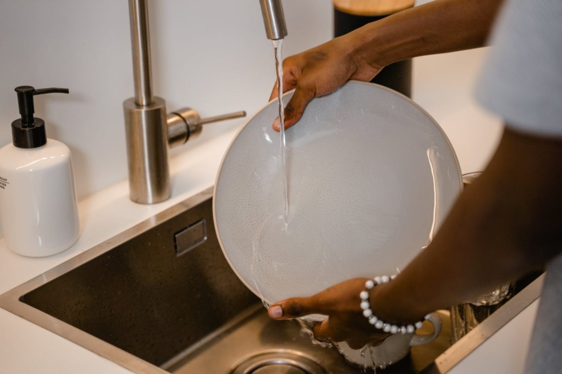 person washing dishes