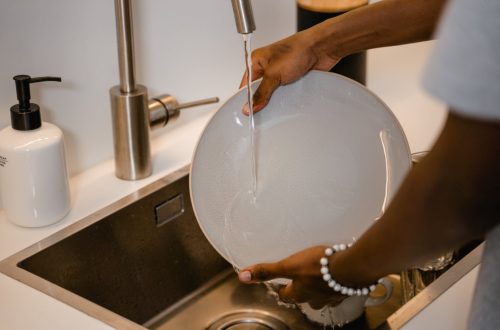 person washing dishes